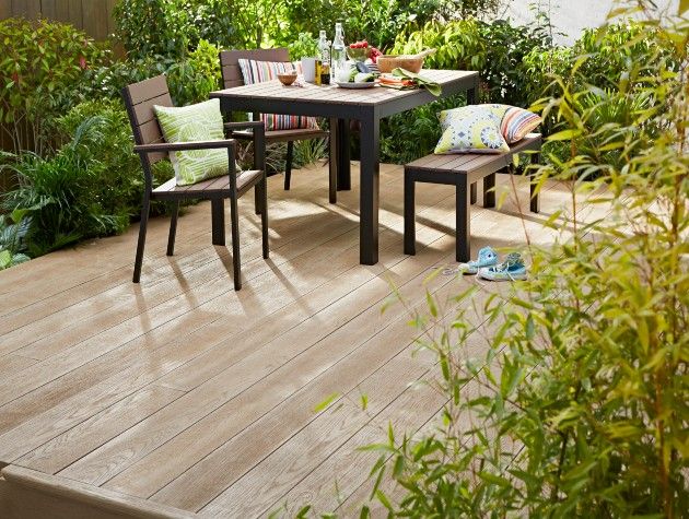 outdoor decked patio with table chairs and food