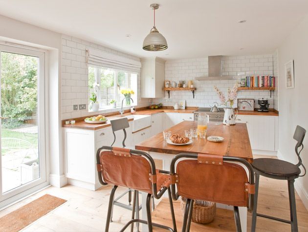 Open plan kitchen diner with island unit and window seat 3