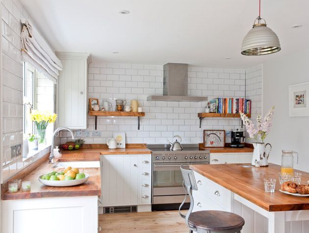 Open plan kitchen diner with island unit and window seat 4