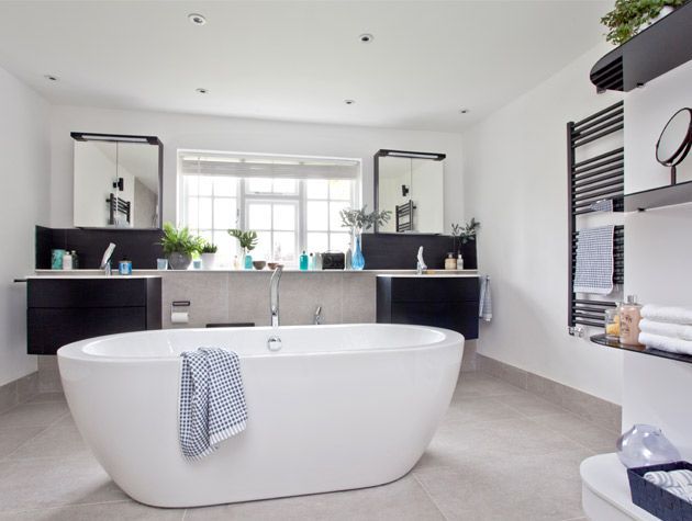 Elegant bathroom with tub centrepiece 1