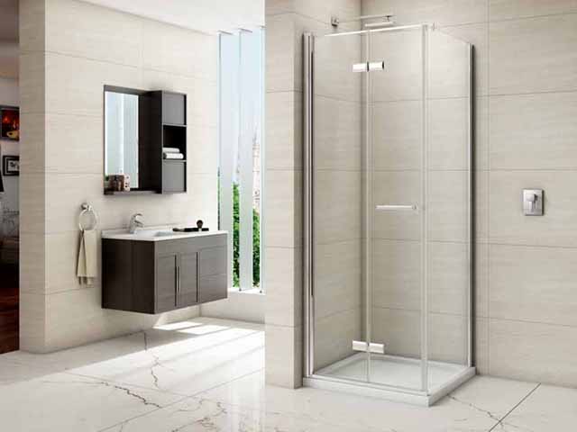 frameless bifold side panel shower by merlyn in a large bathroom suite