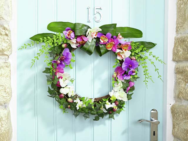 flower wreath on a blue front door by house of bath 