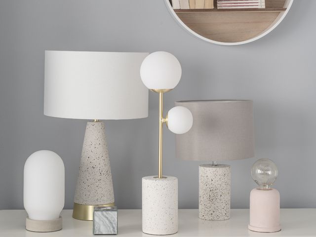quartz, marble and concrete bases on a selection of table lamps on a white sideboard by bhs for spring summer 2018 