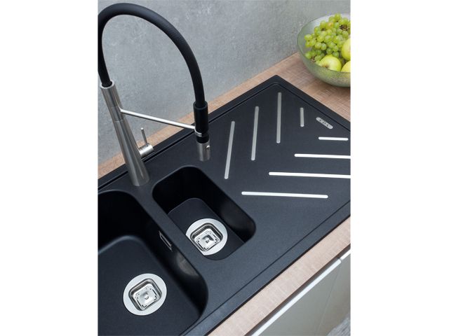 matte black composite sink with stainless steel detail trivet by cda appliances 