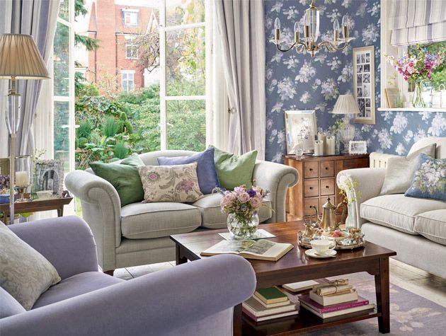 living room featuring navy and lavender floral wallpaper from laura ashley