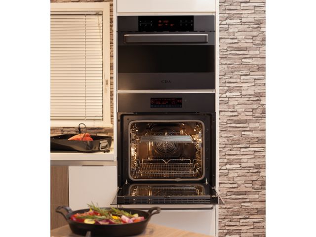 black microwave oven by cda appliances in a real kitchen 