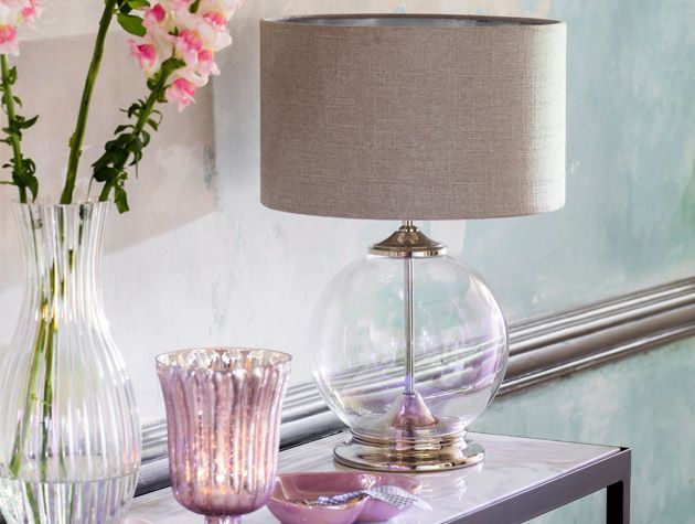 purple iridescent lamp and vase on drawers