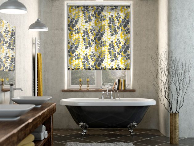 stone grey bath room scheme with yellow grey and white leaf rpint blind