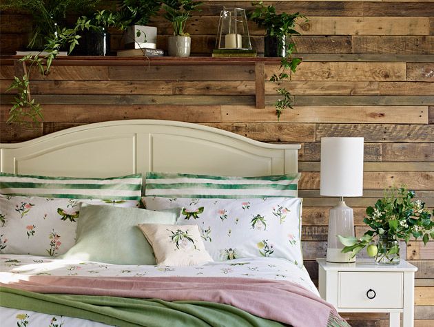 botanical themed bedroom with decorative plants and floral bedding