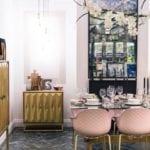 pink chairs, statement lighting and gold furniture in the dining room at good homes roomsets at ideal home show 2018