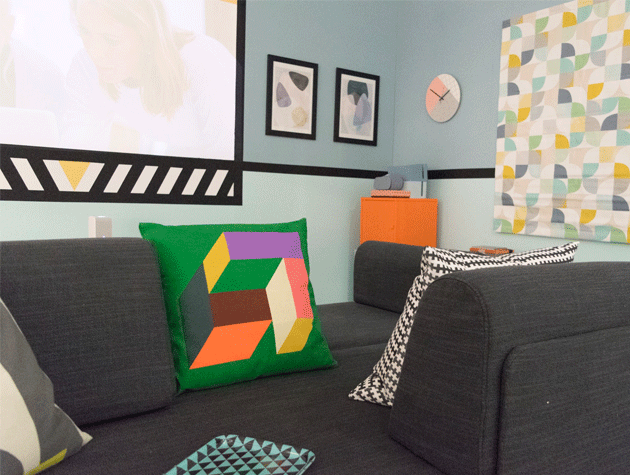 media room with abstract framed prints on wall