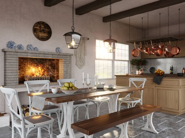 country farmhouse kitchen with traditional wood fire and lanterns over the dining room table