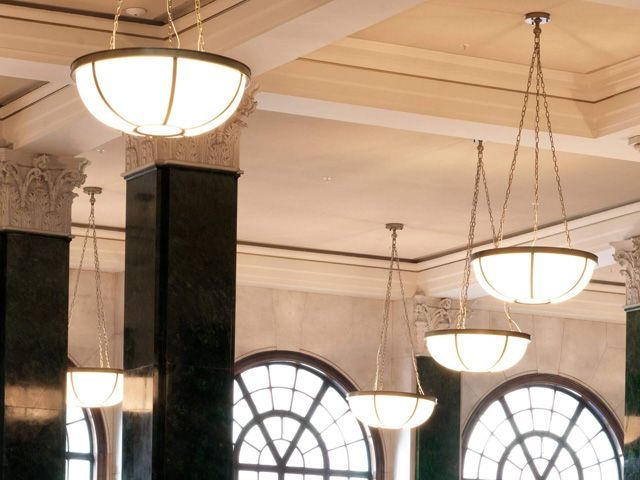 '20s style lutyens lighting pendants hanging in the dining room at the ned hotel london