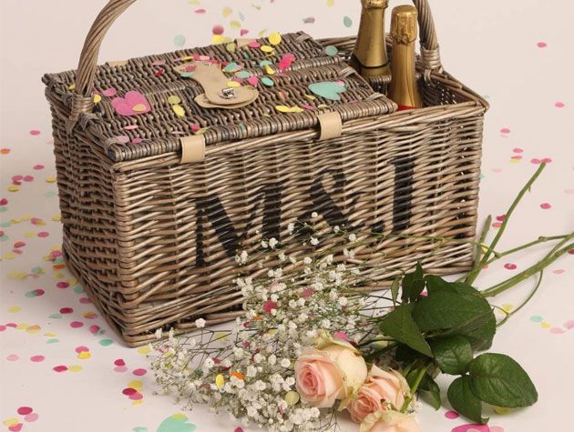 wedding picnic basket gift with champagne crockery cutlery and flowers