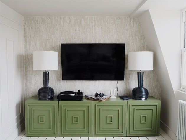 biege and white decorated tv room with olive green tv unit