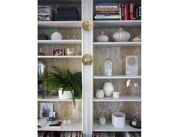 book case with distressed effect wallpaper backing