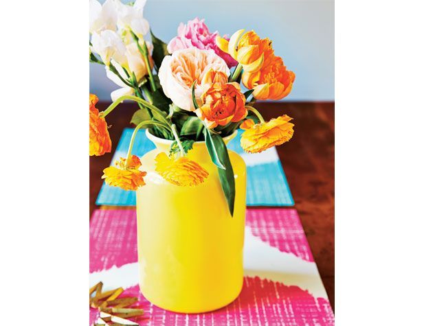 orange pink white and peach flowers in yellow vase