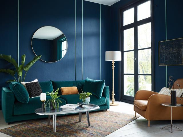 habitat aw18 collection featuring midnight blue decor, clemence sofa in a large living room with wood furniture