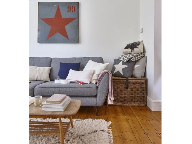 modern victorian living room with grey sofa wooden flooring star wall art