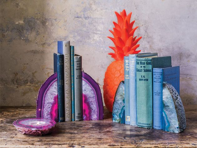 Purple and blue agate style book ends on brown wooden table -mel-yates-living-room-goodhomesmagazine.com