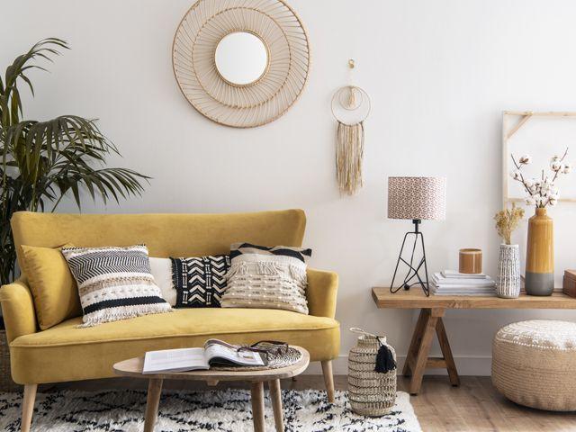 yellow sofa in a neutral decorated living room from aw18 maison du monde collection - living room - goodhomesmagazine.com