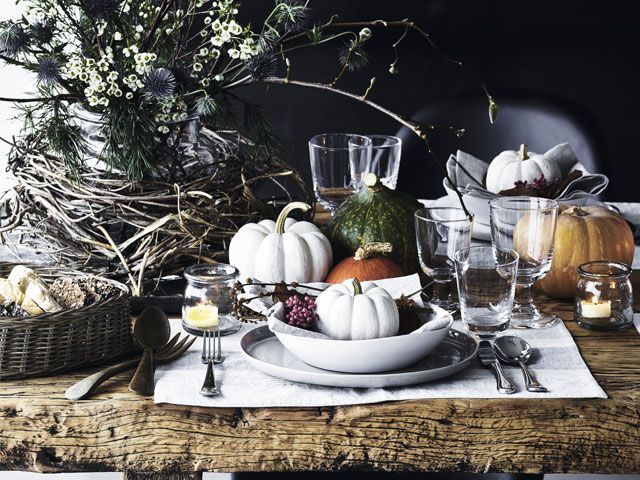 Halloween themed dining table decor with white pumpkin and shapely gourds -the-white-company-living-room-goodhomesmagazine.com