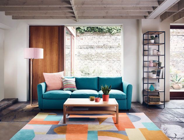 living room blue sofa bright multi colpured rug habitat good homes magazine