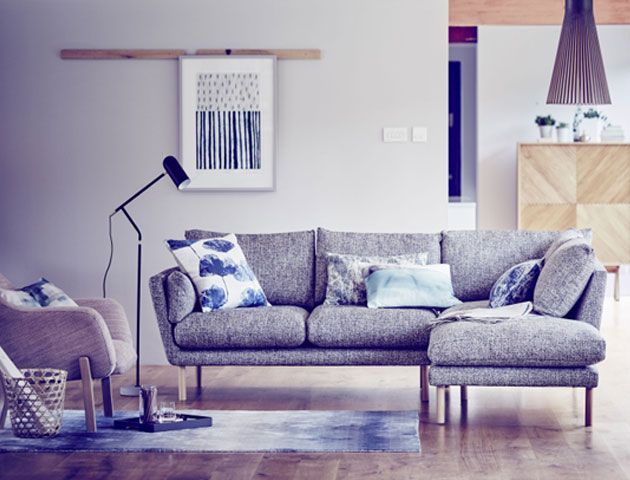 Living room with grey sofa, blue cushions and a black freestanding lamp -john-lewis-living-room-goodhomesmagazine.com