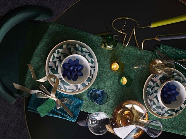 Christmas dining table setting with emerald green table runner, candelabra and geometric plates -john-lewis-and-partners-goodhomesmagazine.com
