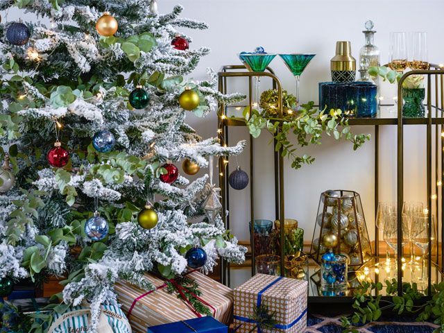Christmas tree and gold bar cart featured in Lorraine Kelly's Christmas cottage makeover -wayfair-uk-home-tours-goodhomesmagazine.com