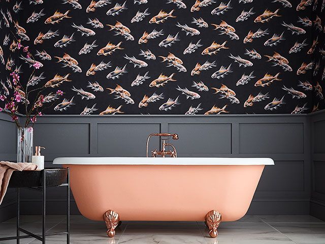 fish print wallpaper in black and blush pink in a bathroom by Graham & Brown - wallpaper trends 2019 - goodhomesmagazine.com