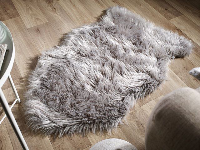 Grey sheepskin rug on wooden flooring -the-rug-seller-living-room-goodhomesmagazine.com
