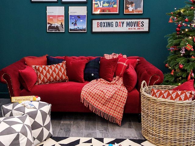 maisons du monde red sofa in the boxing day living room at the good homes roomset at Ideal Home Show Xmas 2018