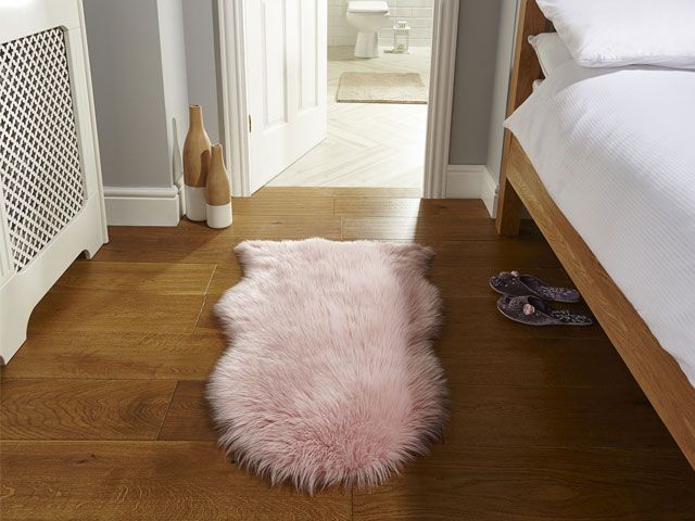 Pink sheepskin rug in ensuite bedroom -the-rug-seller-living-room-goodhomesmagazine.com