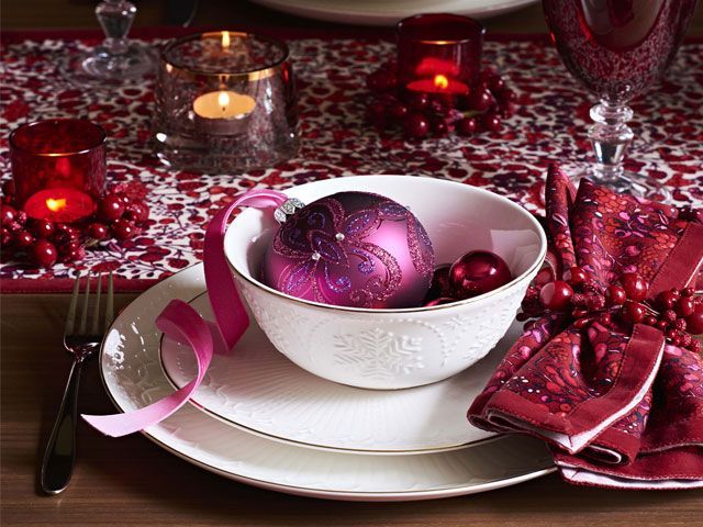 Ruby red-themed Christmas dining table setting with purple baubles -john-lewis-and-partners-dining-table-goodhomesmagazine.com