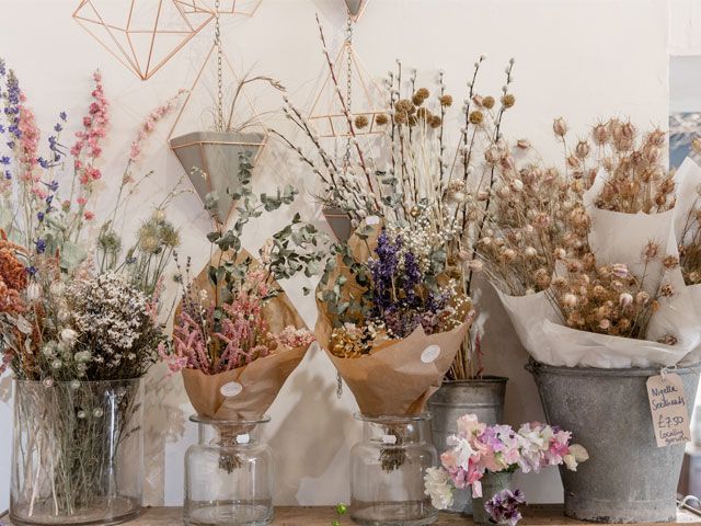 Display of dried plants and flowers in vases trouva-living-room-goodhomesmagazine.com