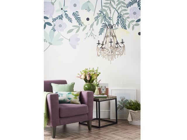 Purple arm chair in living room decorated with floral wallpaper -living-room-goodhomesmagazine.com