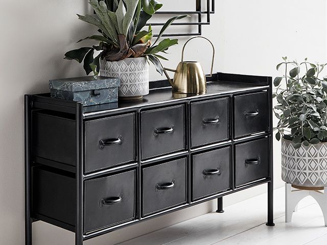 Black sideboard storage in hallway