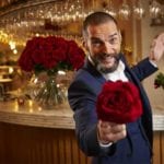 Fred Sirieix in First Date's resturant holding a rose