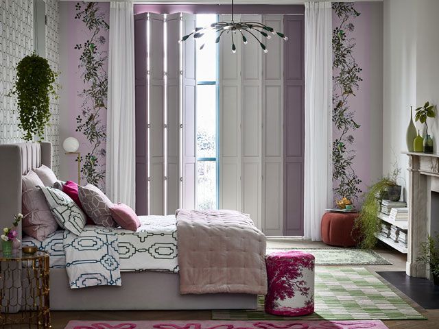 solid tracked shutters and voile curtains by Hillarys in a lilac bedroom
