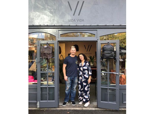 Matt and Andreya, founders of Vida Vida stood outside Vida Vida store entrance -notonthehighstreet-living-room-goodhomesmagazine.com