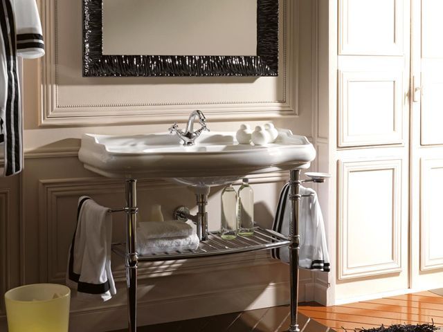 albion baths formello console basin in chrome on a stand in a small bathroom with black frame mirror