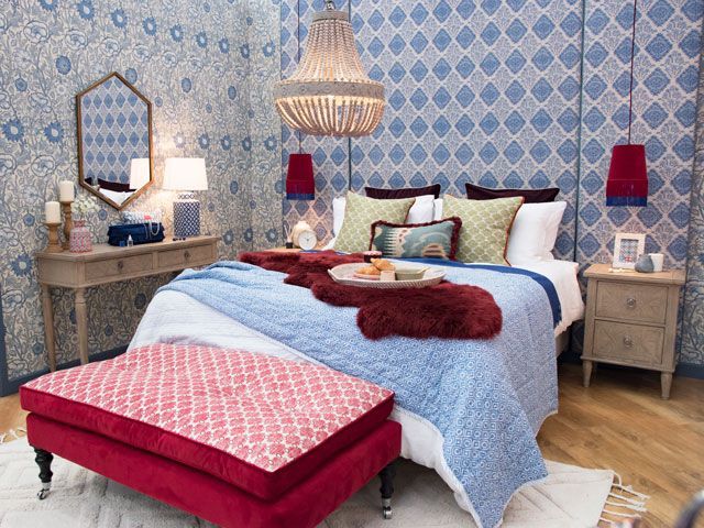 blue floral wallpaper, large bed with Unikbed mattress in the Queen's bedroom in the Good Homes roomsets at Ideal Home Show 2019
