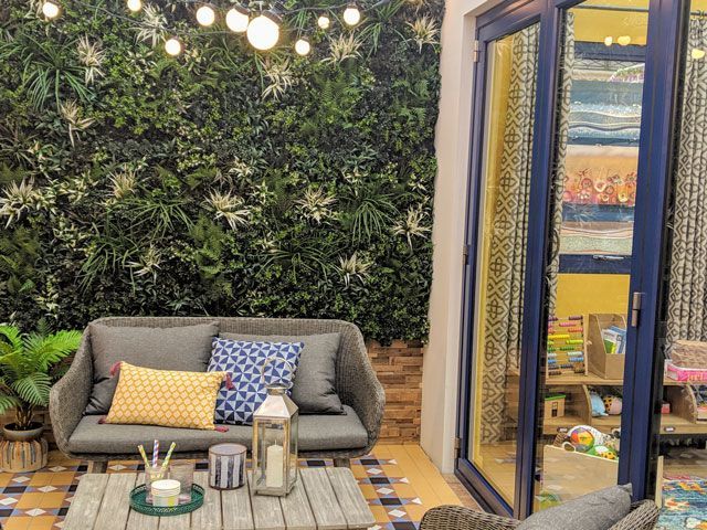 living wall in outdoor area plants and moroccan tile flooring in good homes roomsets at ideal home show 2019