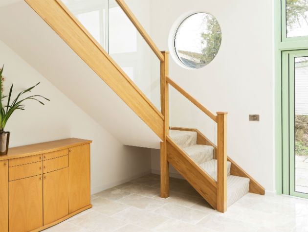 lobby of house with wooden staircase