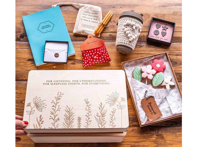 A thoughtful Mother's Day gift box with candles, sweet treats, a note pad and reusable coffee cup -notonthehighstreet-shopping-goodhomesmagazine.com