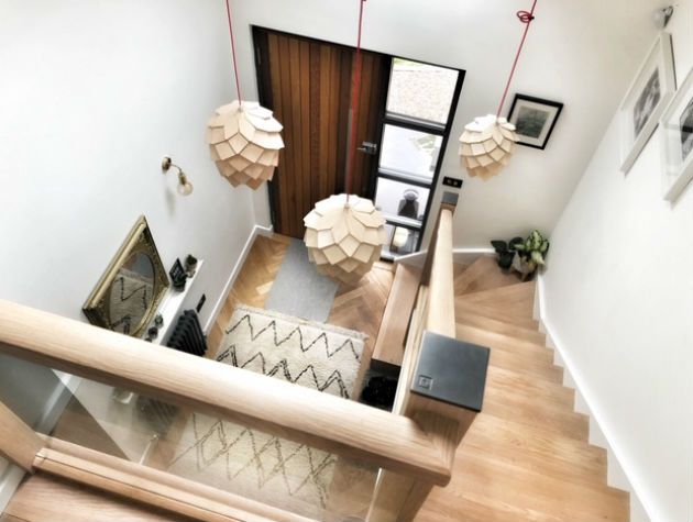 view down to hallway from top of wooden stairs