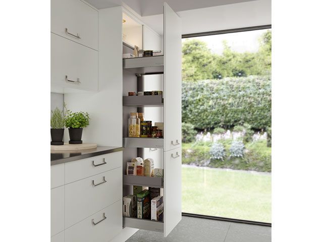 A white fitted kitchen with pull out larder unit -masterclass-kitchens-ktichens-goodhomesmagazine.com