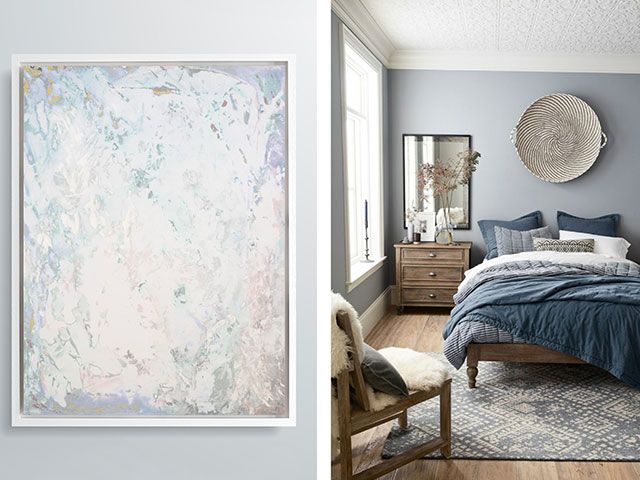 A blue calming bedroom with subtle abstract artwork