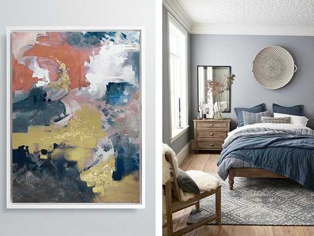 A blue bedroom with bold abstract artwork